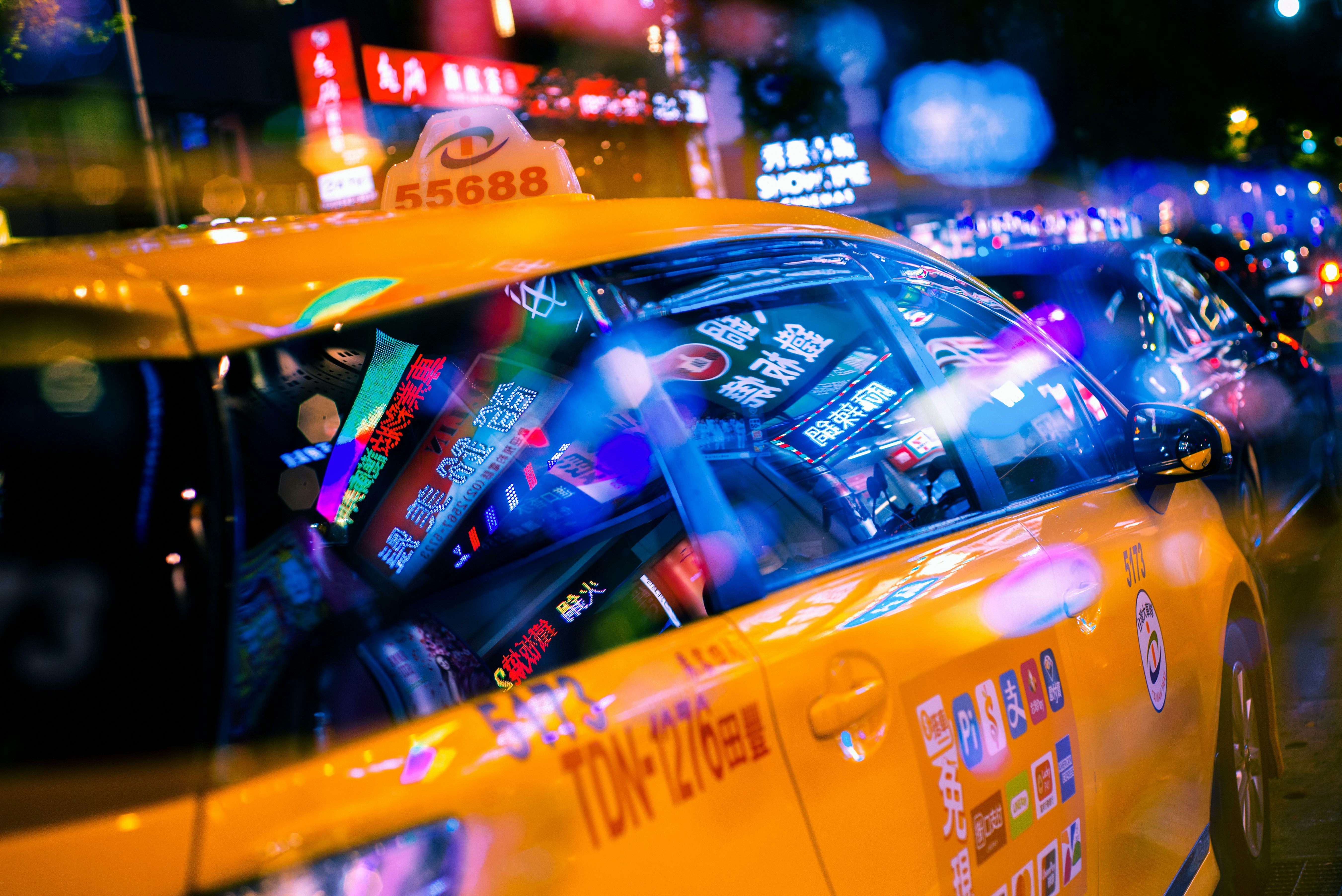 yellow taxi cab on street during night time